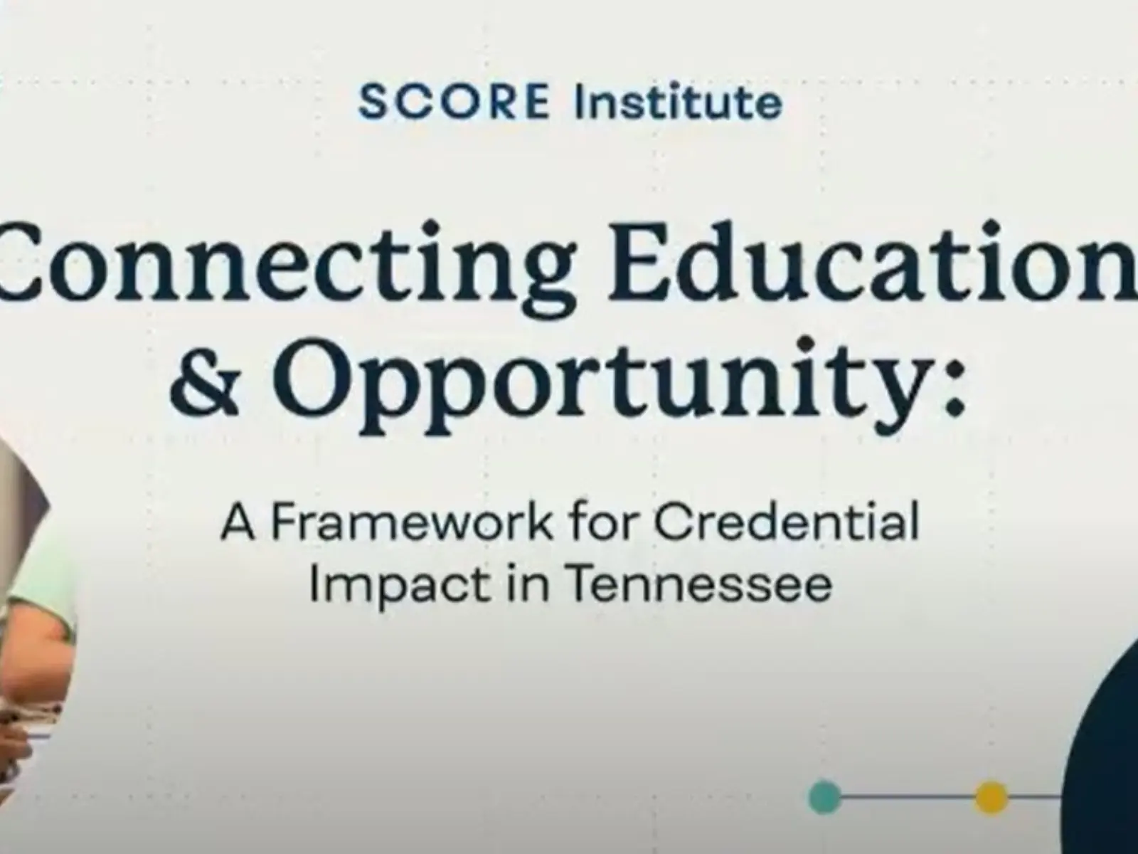 A young boy studies intently, while adults collaborate nearby, showcasing educational focus and community engagement in Tennessee.