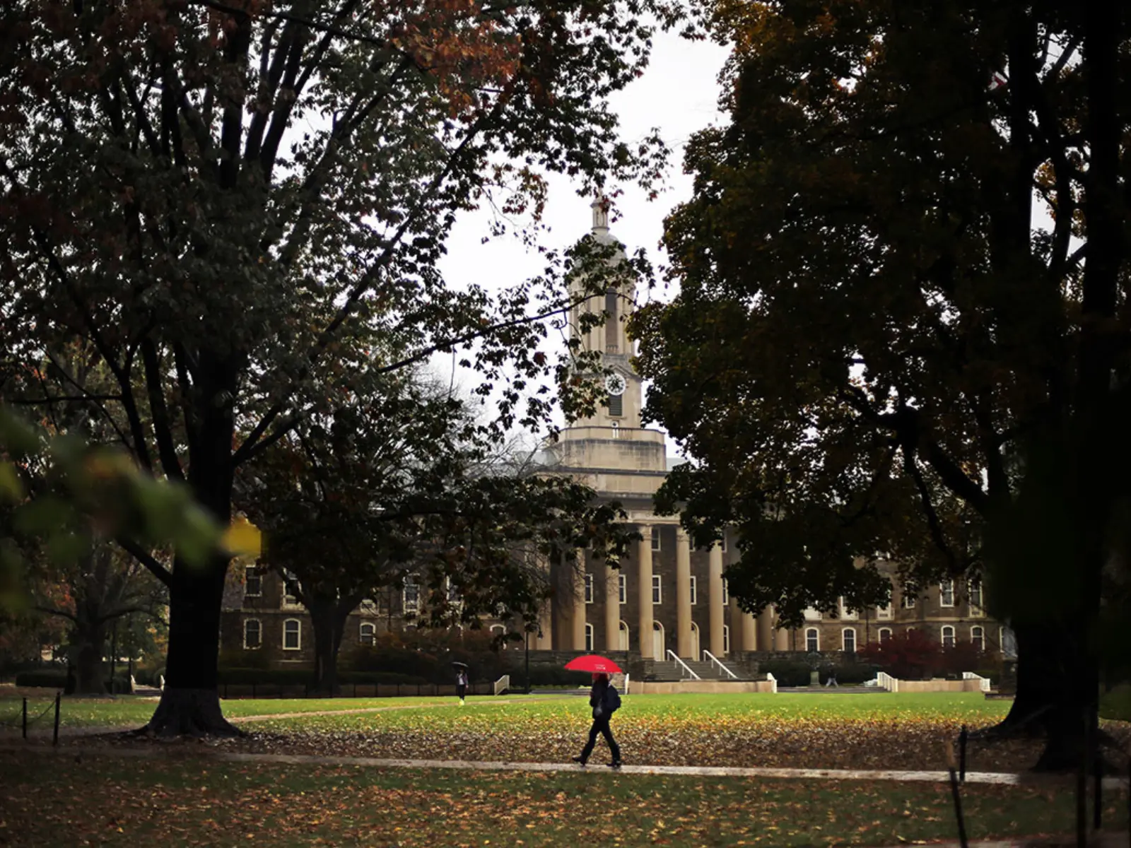 A Penn State student walks on campus.