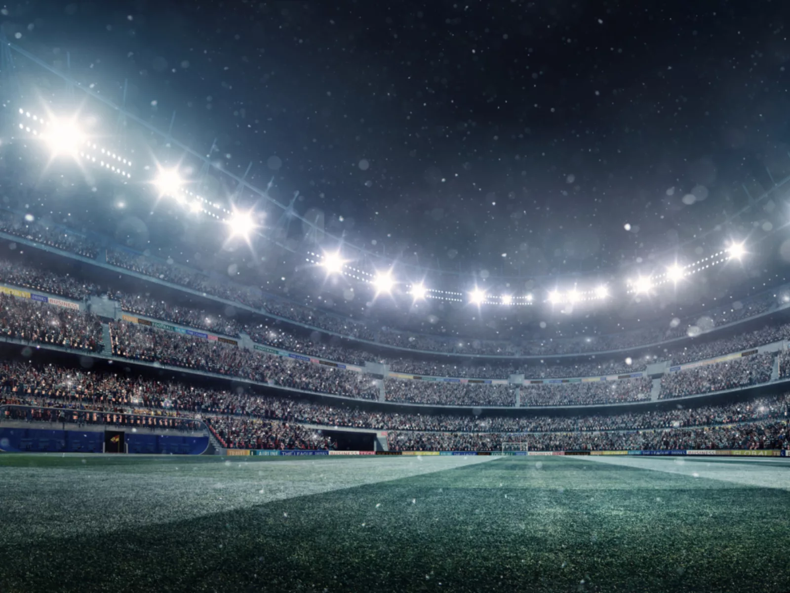 A packed stadium illuminated by bright lights, with a vibrant crowd cheering and a snowy atmosphere enhancing the thrilling scene.