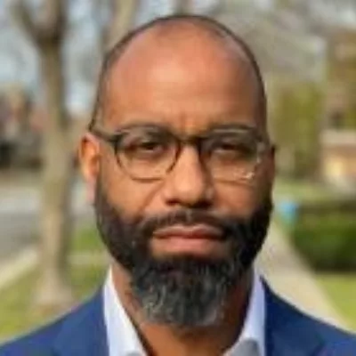 Headshot of Reuben Jonathan Miller