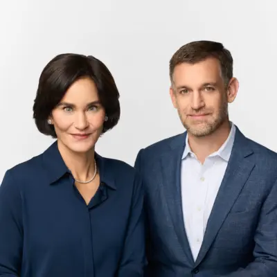 Headshot of Laura and John Arnold